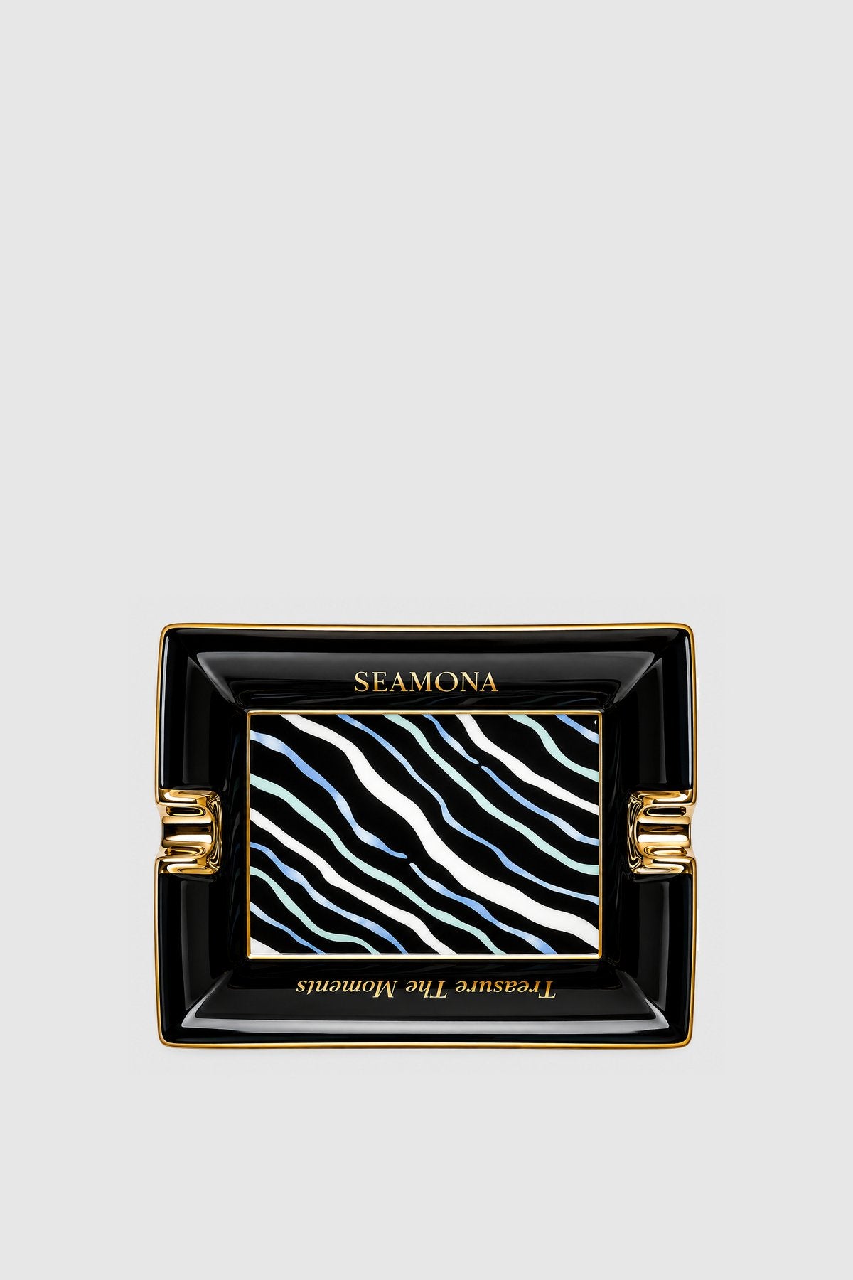 Angel black porcelain ashtray with wave motif, front view