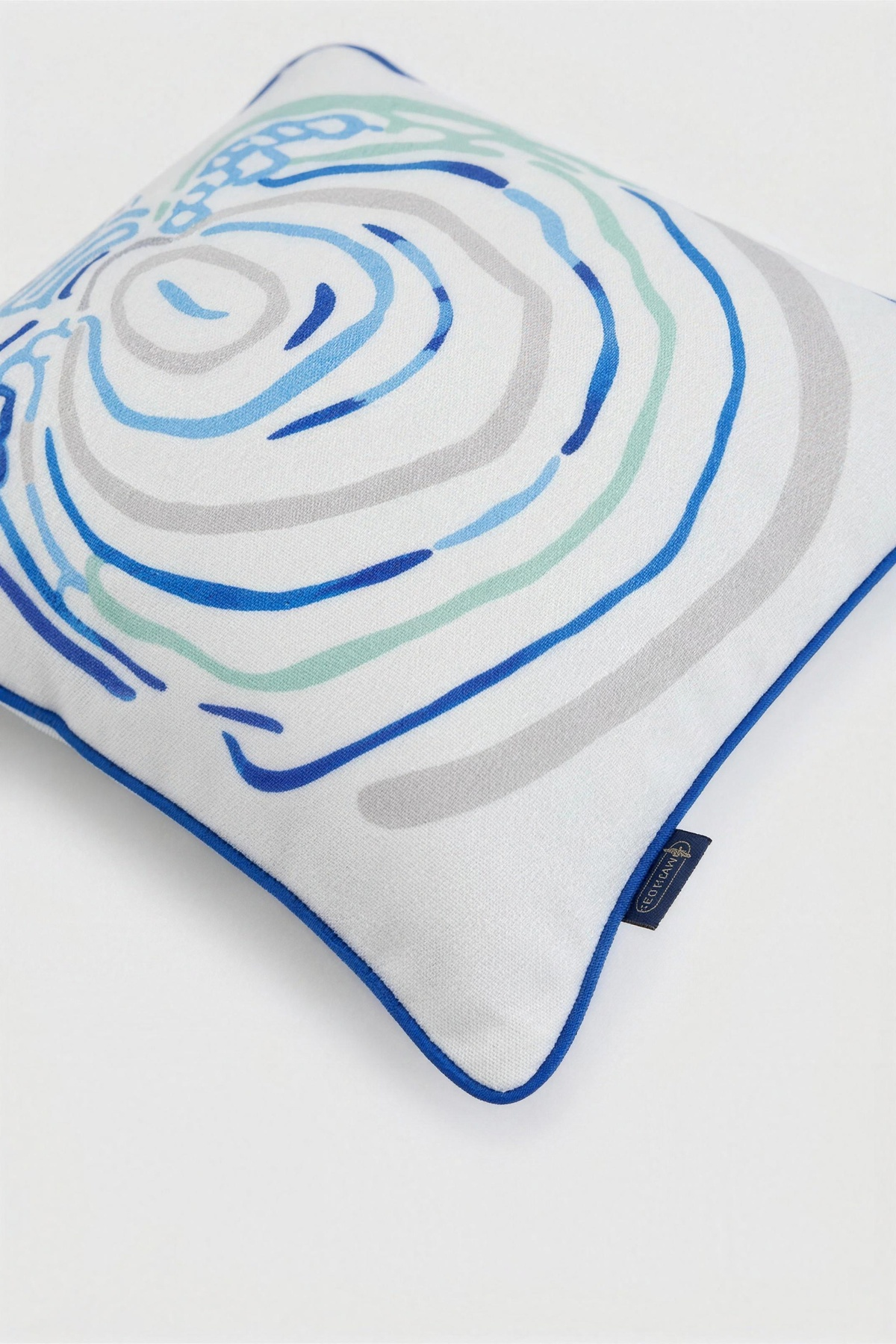Angel white fish pillow 40x40 with blue and teal rings, view 2