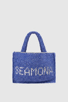 Handmade marine blue woven daily bag with Seamona logo, front view